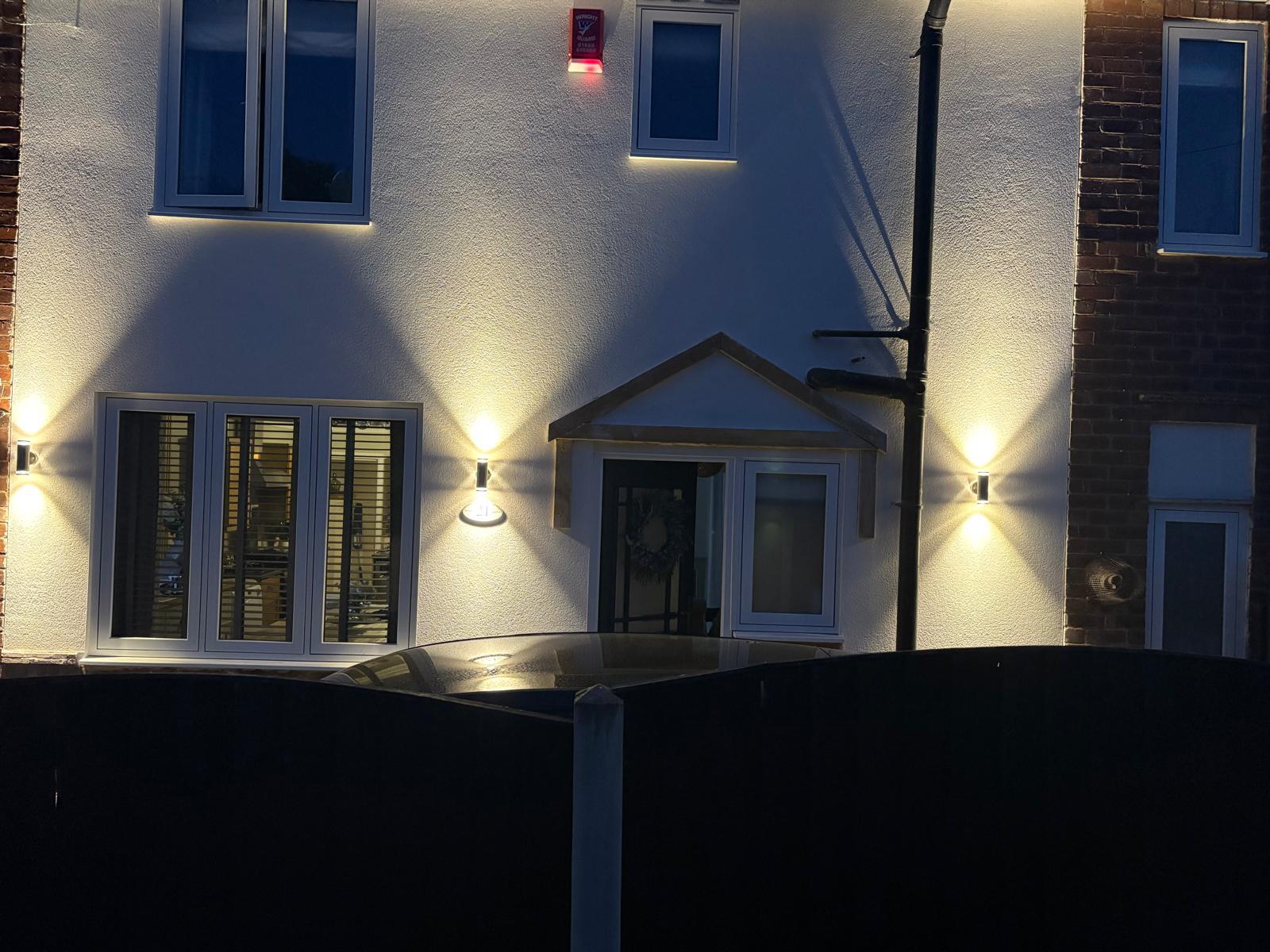 Exterior up/down wall lights fitted to house front