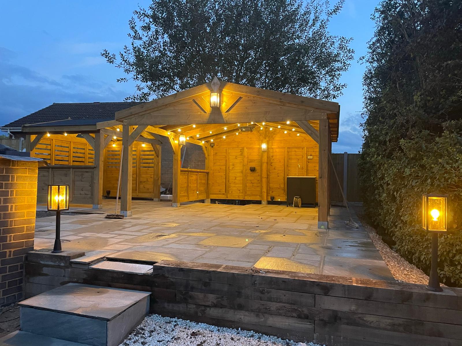 Garden gazebo with festoon lights and lanterns