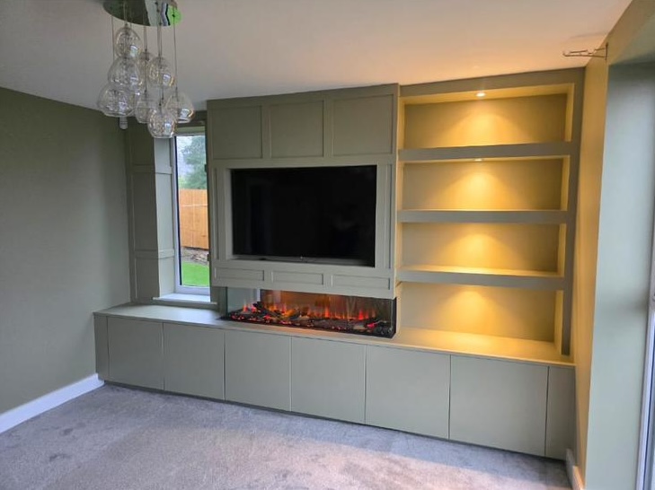 Living room TV unit with electric fireplace and shelf lighting
